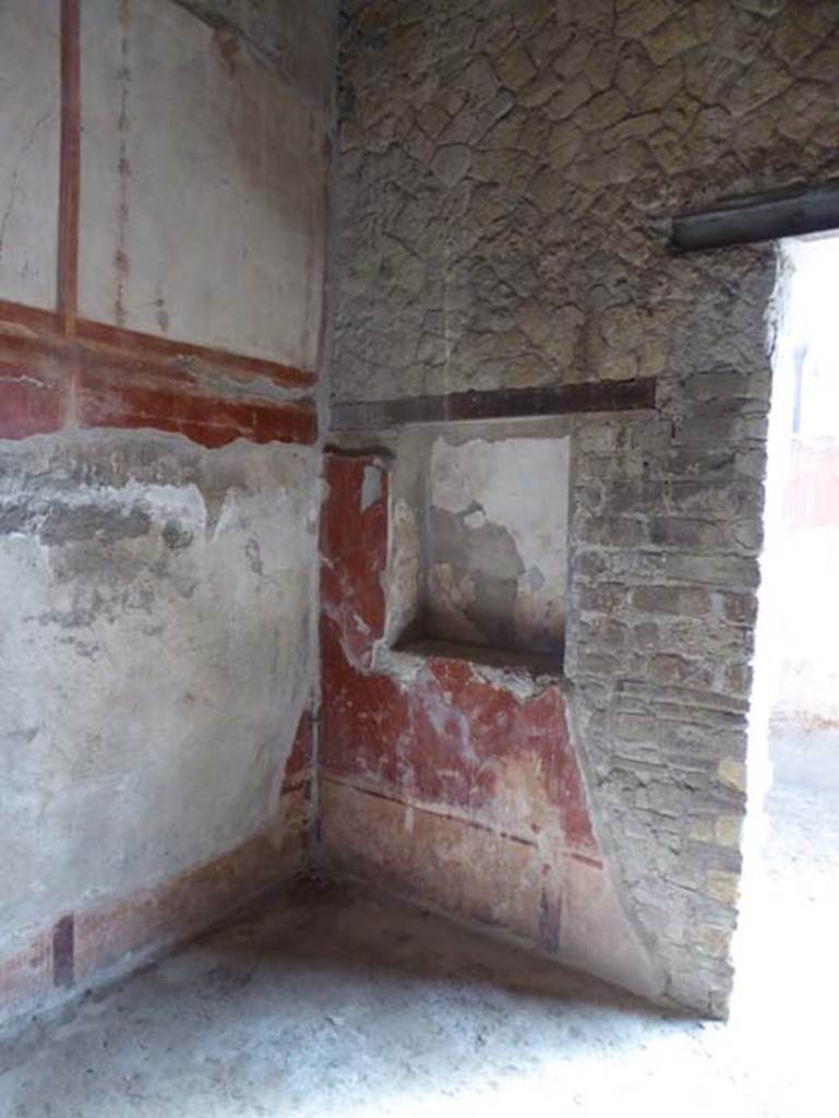 IV.4, Herculaneum, October 2014. Room 4, east wall of cubiculum with doorway to small courtyard 3. Photo courtesy of Michael Binns.